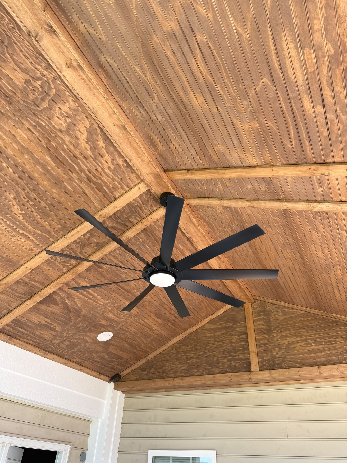 Stained wood porch ceiling